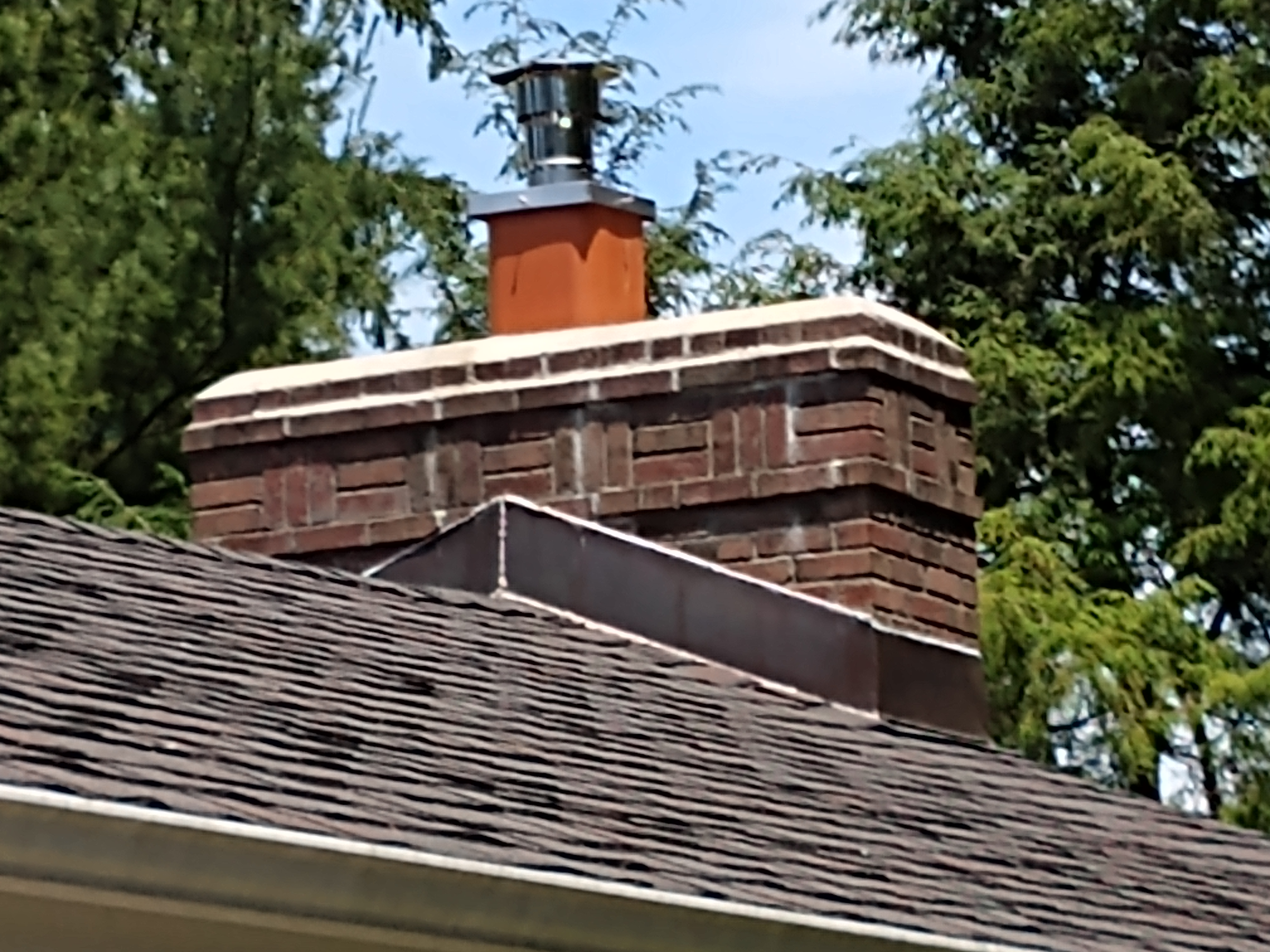 Stainless steel chimney cap with animal guard in Bay Shore, New York